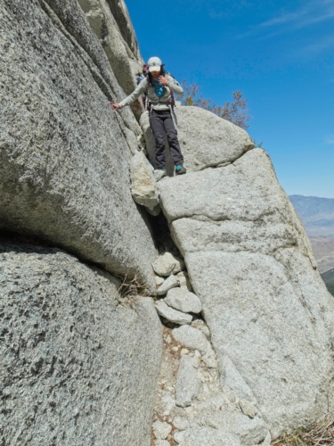 Kim navigates a problem on the Ebersbacher Ledges mount whitney mountaineers route ebersbacher ledges
