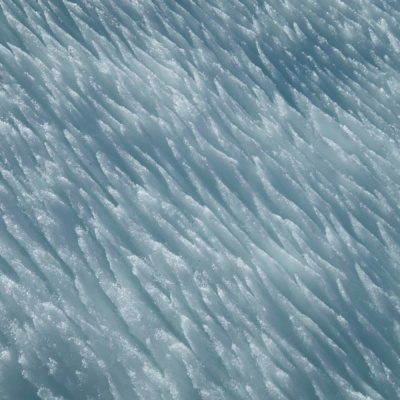 The snow is covered with thin blades of frost snow frost