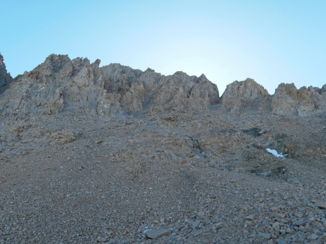 Upon reaching the foot of Mount Williamson, our first goal is to climb up toward the "black stain" seen near the middle of the frame mount williamson