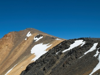 The peak is painted all sorts of colors white mountain peak