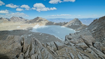 The desolate highlands north of the ridge hold a massive, frozen lake tulainyo lake