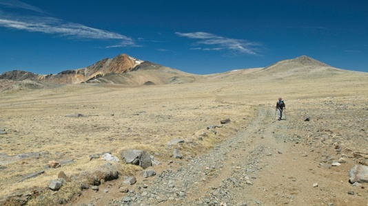 Looking back at the mountain from across the vast plateau white mountain peak