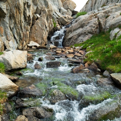 Water tumbles through the rocks toward Darwin Bench from the lakes below Mount Goethe cascade