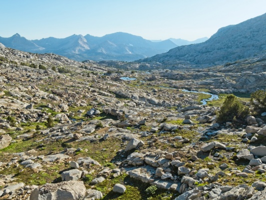 I sit on a rock near my tent and stare out at this view for an hour as the sun sinks toward the horizon darwin bench