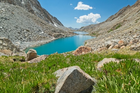 After much rock-hopping, I finally reach firm, grassy ground near the canyon floor darwin canyon