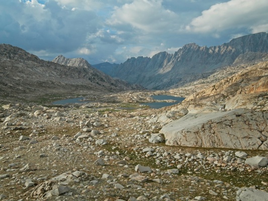 The dark clouds drift away and sunlight returns to Evolution Basin evolution basin