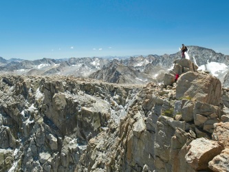 A fellow climber stands atop Mount Lamarck North mount lamarck