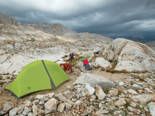 I set up a clothesline at my campsite to dry out gear that got soaked during the first downpour; another approaches wanda lake thunderstorm