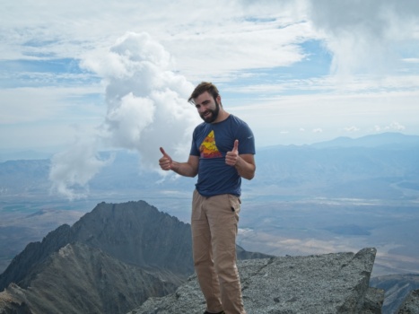 Alex poses on the summit split mountain