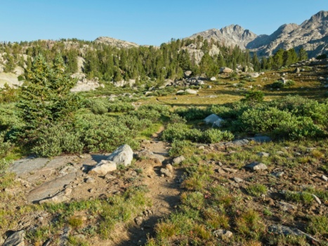 The warm morning light casts long shadows as we hike the second half of the Cook Lakes Loop wind river range