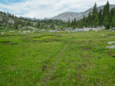 The trail grows faint as we climb toward the Cook Lakes wind river range