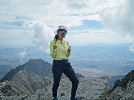 Kim poses on the summit split mountain
