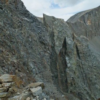 These pinnacles are curiously separated from the ridge as if someone sliced through with an enormous chainsaw split mountain