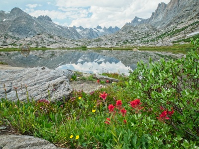 A glassy reflection of the peaks surrounding Titcomb Basin wind river range titcomb basin