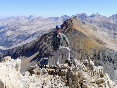 Yours truly posing like Captain Morgan at the summit of Triple Divide Peak. Photo credit: Craig triple divide peak