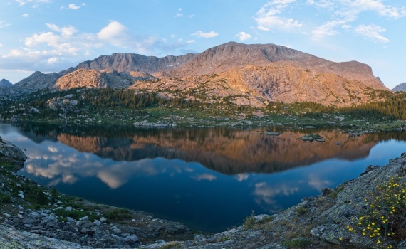 We scramble up to a rocky hill at sunset to get a nice view wind river range cook lake