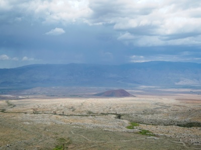 Rain and lightning strike the White Mountains across the valley thunderstorm