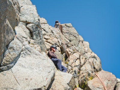 Craig rappels down a steep section mountaineering