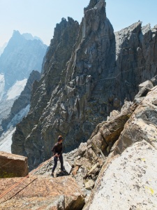 Jeff rappels down to the notch - behind him, the ramp route up to Palisade Crest is obvious palisade crest