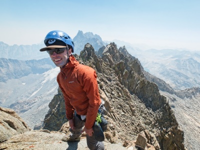 I pose (very carefully) on the Palisade Crest summit block. Photo credit: Craig palisade crest
