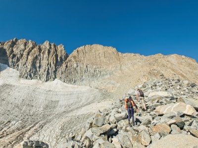 We scramble up the ridge, staying well clear of the loose crap by the glacier. Our destination is Palisade Crest, the peak to the left of the deep notch palisades
