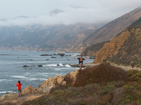Carson poses in front of the spectacular view big sur