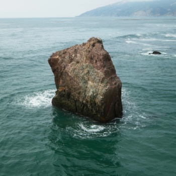 A rock protruding from the sea just off the coast big sur