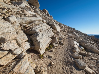 Some interestingly layered rocks line the trail to New Army Pass new army pass