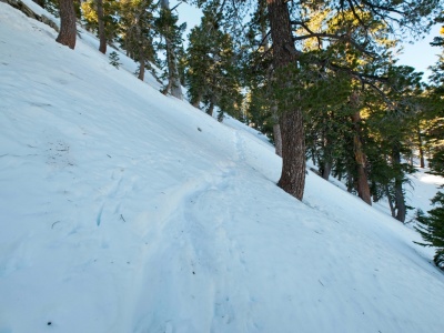 A few footprints lead across the icy slope toward Ontario Peak ontario peak trail