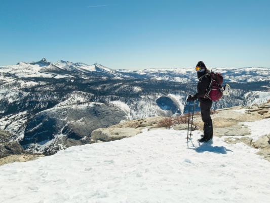 Kim looking out on the Sierra Nevada clouds rest