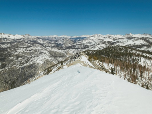 The snow-capped Sierra peaks from Clouds Rest clouds rest