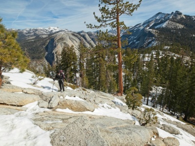 Kim hikes up some exposed stairs on Sub Dome half dome trail