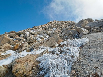 Thin clouds blow past the summit of Olancha Peak olancha peak
