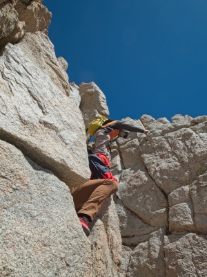 Egor and Peter scramble down from the notch mountain climbing