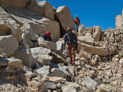 Sarah, Peter, and Egor descending from Joe Devel Peak mountain climbing