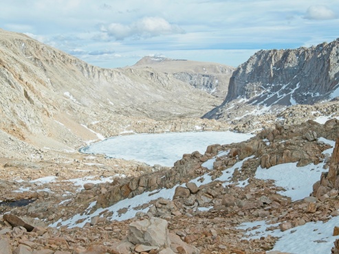 Looking south from Crabtree Pass is another frozen lake and, in the distance, Mount Langley! miter basin