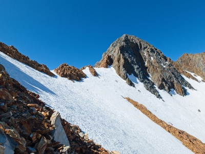 Up close the snow is a little less steep but I'm still holding out hope for dry ground on the ridge itself red and white mountain
