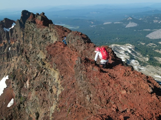 Craig and Linda scramble down the summit ridge broken top