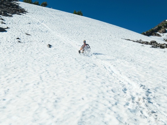 Craig slides down the snow glissade