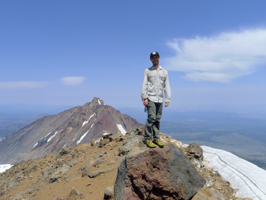 I stand on the high point of Middle Sister. Photo credit: Craig middle sister summit