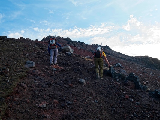 Craig and Linda struggle up the loose slope north sister