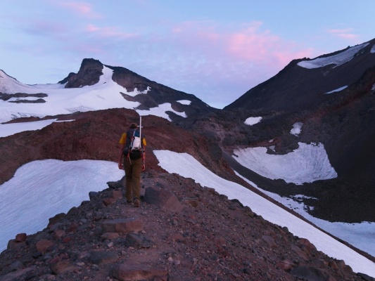 Craig hikes up a moraine glacial terrain