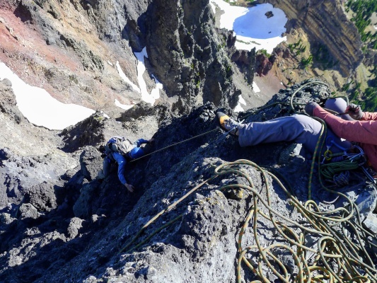 I climb the chossy rock step while Linda belays from above. Photo credit: Craig mount washington rock climbing