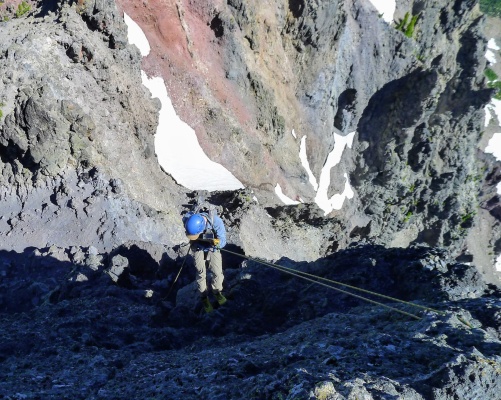 Rappelling down to the saddle. Photo credit: Craig mount washington rock climbing