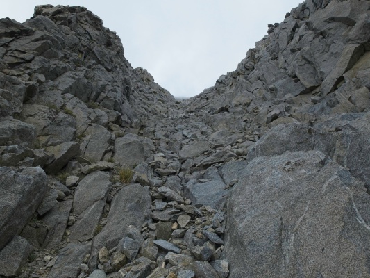 A chute leads up the southeast face of the mountain temple crag chute
