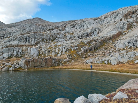 Josh walks along the beach on the way back to camp barrett lakes
