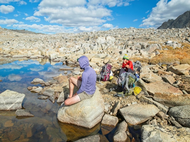 We filter water and eat some snacks beside the lake break time