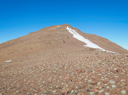 Higher up the peak the firm ground gives way to loose gravel and most of the plant life disappears eagle peak upper slope