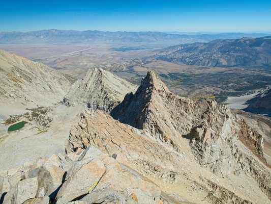 Looking back at the ridge we've already walked along - the saddle is so far away (the low point near the far side of the shadowed slope)! mount humphreys east arete