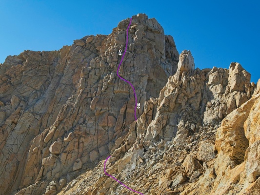 Our (approximate) route up the cliff face just below the summit; existing rappel stations are marked humphreys climbing route